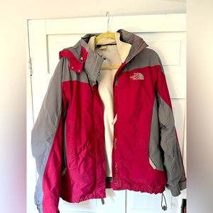 The North Face red and gray ski jacket and cream fleece. Women’s Small/Medium